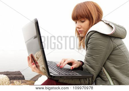 girl using laptop computer