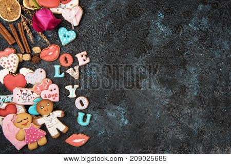Gingerbreads for love or marrige on dark concrete background