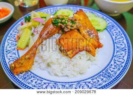 Grilled chicken on top with rice in Combodia style selective focus