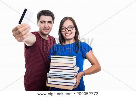 Student Couple Showing Credit Card And Holding Books