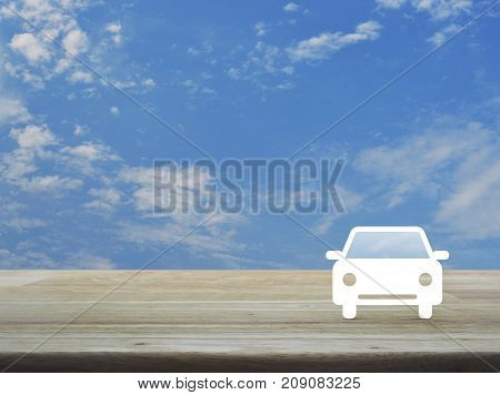 Taxi car flat icon on wooden table over blue sky with white clouds Business service car concept