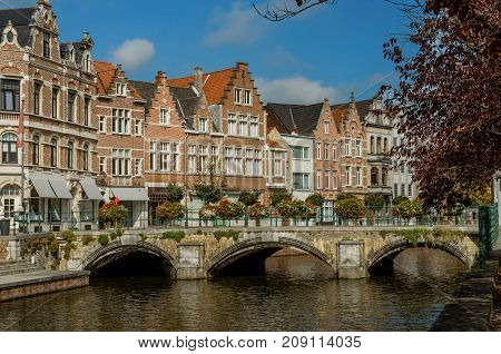 A view of the Belgian city, Lier and moored boats on the river Nete,