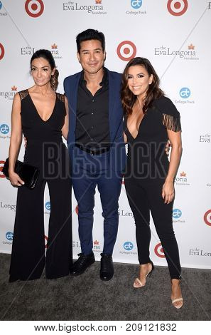 LOS ANGELES - OCT 12:  Courtney Mazza, Mario Lopez, Eva Longoria at the Eva Longoria Foundation Annual Dinner at the Four Seasons Hotel on October 12, 2017 in Beverly Hills, CA