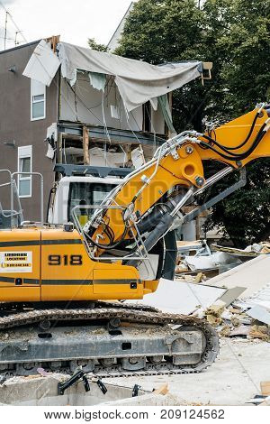 STRASBOURG FRANCE - SEP 9 2017: Liebherr R 918 crawler excavator demolishing temporary building