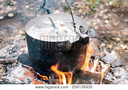 The Process Of Cooking Fish Soup In The Campaign