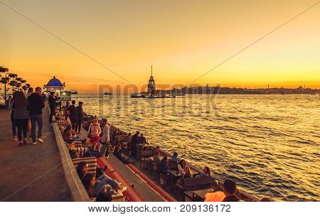 Istanbul Turkey: People are spending leasure time and meeting sunset with view of Maiden's tower in Uskudar on October 11 2017