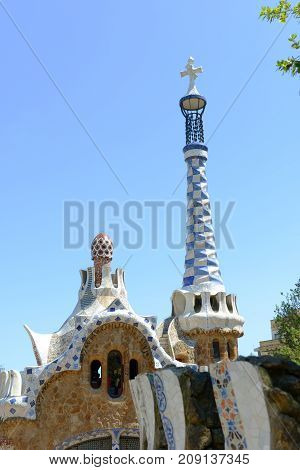 BARCELONA - JUN. 10, 2013: Entrance Pavilions at Park Guell Catalan: Parc Güell, Barcelona, Spain. Park Güell is part of the UNESCO World Heritage Site Works of Antoni Gaudi since 1984.