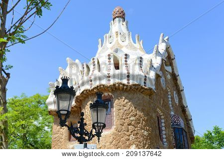 BARCELONA - JUN. 10, 2013: Entrance Pavilions at Park Guell Catalan: Parc Güell, Barcelona, Spain. Park Güell is part of the UNESCO World Heritage Site Works of Antoni Gaudi since 1984.