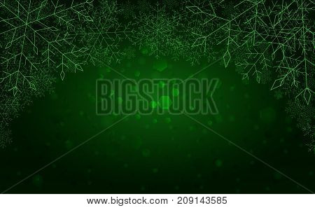 The green beautiful winter background with snowflakes