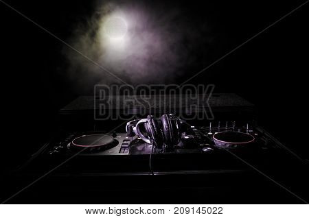 Dj Spinning, Mixing, And Scratching In A Night Club, Hands Of Dj Tweak Various Track Controls On Dj'
