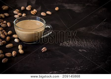 Coffee With Milk And Pistachios On The Table, Copy Space