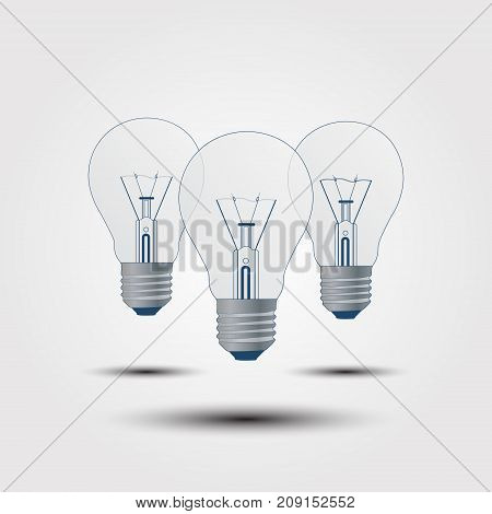 With The Light Bulb On A Gray Background