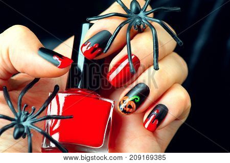 Halloween manicure design ideas. Halloween Nail art design. Nail Polish. Beauty hands. Trendy Stylish Colorful Nails and Nailpolish. Black matte nailpolish with blood drips and pumpkin