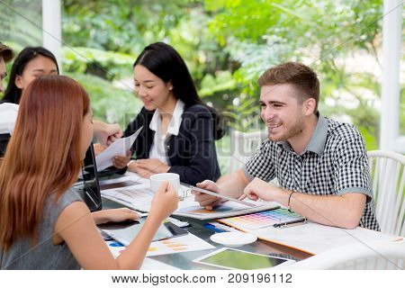 young business people making meeting and talking for analyzing marketing working at office on desk.