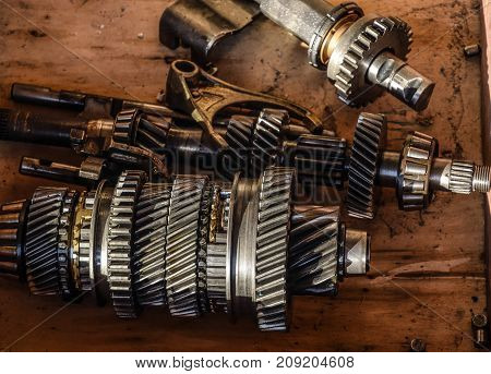 Dismantled Box Car Transmissions. The Gears On The Shaft Of A Me