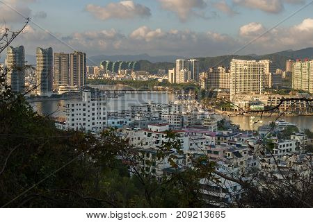 Sanya, China - April 07, 2017: Evening view of Sanya from the top of a hill in a Luhuitou Park