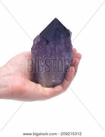 Woman's hand holding Ametrine lightbrary point from Bolivia isolated on white background