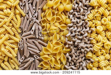 noodles pasta of different kinds scattered on the table.
