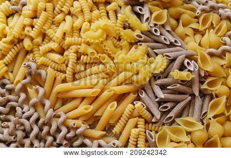 noodles pasta of different kinds scattered on the table.