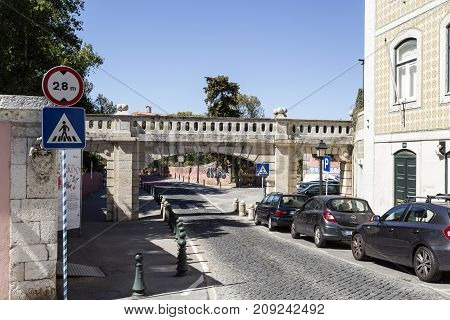 OEIRAS, PORTUGAL - September 17, 2017: Detail of the eighteenth century arched Aqueduct of Arneiro just before the Marquis of Pombal Palace and Gardens in Oeiras Portugal