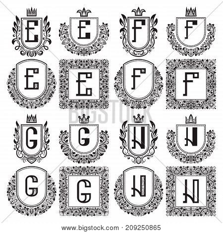 Isolated vintage monograms set. Heraldic logos with E, F, G, H letter. Black coats of arms in wreaths, round and square frames.