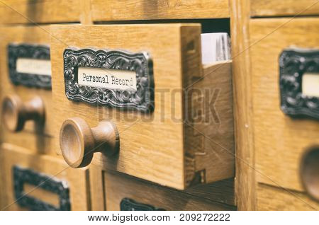The Archives Card Catalog old wooden file catalog box index database archive and library concept.