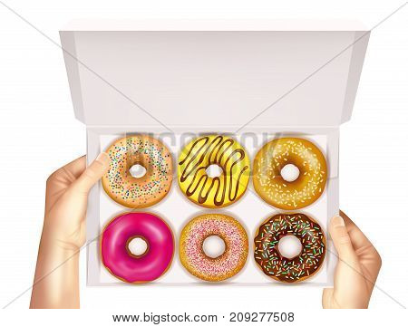 Realistic colorful donuts with sprinkles, glaze and sesame seeds in open white box in hands vector illustration