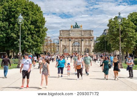 PARIS,FRANCE - JULY 29,2017 : Locals and tourists at the Tuileries Garden on a summer day in Paris