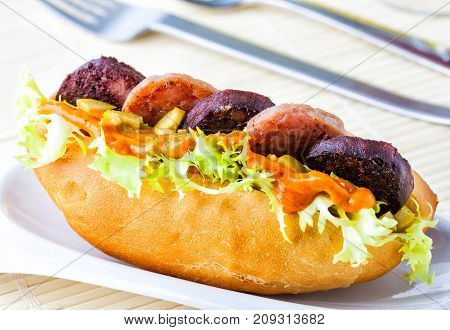 Subway sandwich with different kinds of sausages
