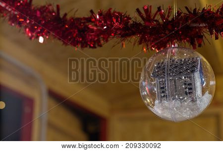 christmas ball with snow inside to december