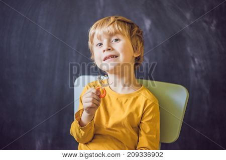 Three-year Old Boy Shows Vestibular Plate. Plate With A Bead To Stimulate The Tongue. Dysarthria, Rh