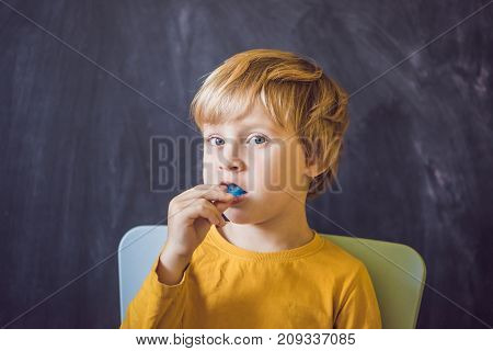 Three-year Old Boy Shows Myofunctional Trainer. Helps Equalize The Growing Teeth And Correct Bite, D