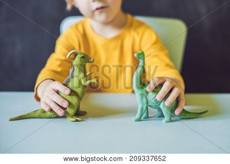 Boy Showing A Dinosaur As A Paleontologist