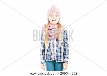 Studio portrait of little girl wearing knit hat and snood scarf
