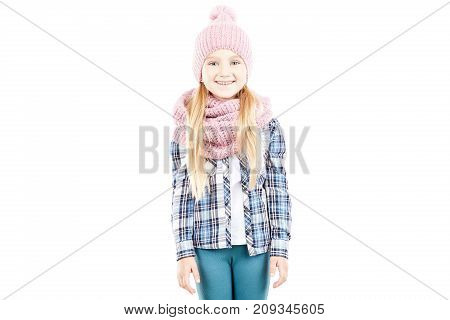 Studio portrait of little girl wearing knit hat and snood scarf