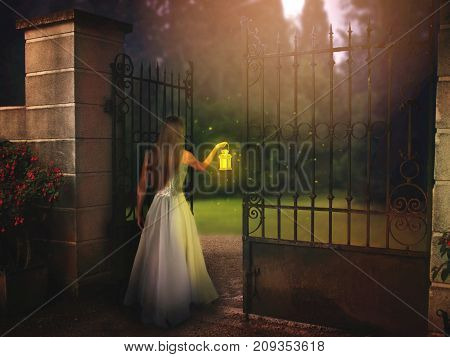 Young woman standing by the gate in night with lantern