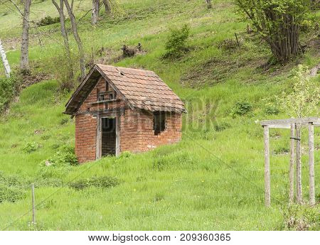 small rural tool shed at a hillslope