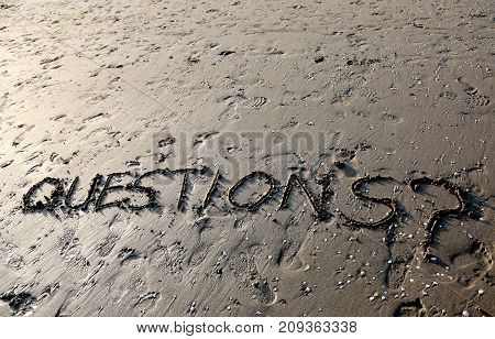 Text Questions With Question Mark Written On The Sand