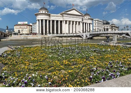 SKOPJE, REPUBLIC OF MACEDONIA - 13 MAY 2017: Skopje City Center - Archaeological Museum and Bridge over Vardar River, Republic of Macedonia