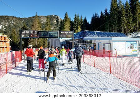 JASNA SLOVAKIA - JANUARY 22: The skiers and Lucky-Vyhliadka cableway station in Jasna Low Tatras. It is the largest ski resort in Slovakia with 49 km of pistes on January 22 2017 in Jasna Slovakia