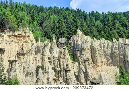 Earth Pyramids can be found in Ritten above Bolzano near Klobenstein Oberbozen and Unterinn; or Platten near Percha in the Puster Valley.