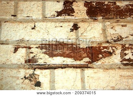 Brick wall of white brick with brown spots. background