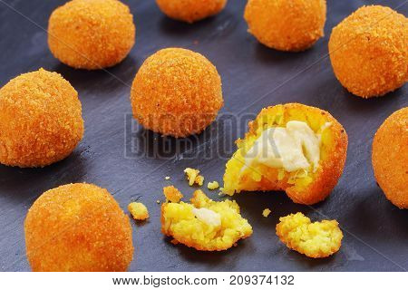 Arancini - Saffron Rice Balls Stuffed With Cheese