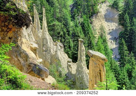 Earth Pyramids can be found in Ritten above Bolzano near Klobenstein Oberbozen and Unterinn; or Platten near Percha in the Puster Valley.