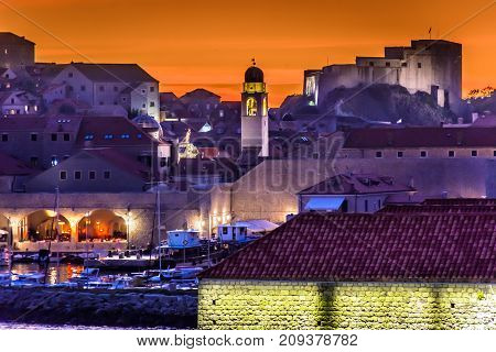 Sunset over medieval town Dubrovnik, famous tourist travel destination on Adriatic Sea, Croatia Europe.