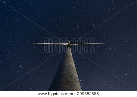 Windmill Under The Starry Sky At Night