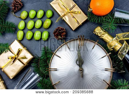 NEW YEAR TRADITION. Latin American and Spanish New Year traditional. Funny ritual to eat twelve 12 grapes for good luck at midnigth. Flat lay, top view. Christmas New Year composition