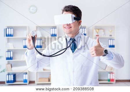 Young doctor with vr virtual reality headset working in the offi