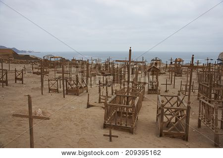 Pisagua, Tarapaca Region, Chile - August 30, 2017: Historic cemetery from the era of nitrate mining in the Atacama Desert, at Pisagua on the coast of northern Chile