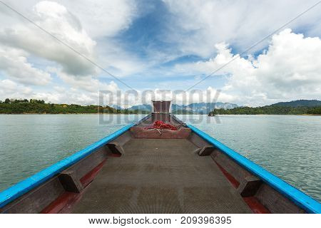 The Nose Of A Long-tailed Boat Against The Background Of The Karst Rocks Of Lake Cheo Lan